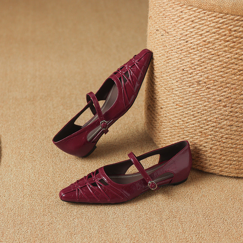 Burgundy Mary Jane flats pair with ankle strap, buckle, laced uppers, pointed toe.