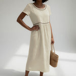 Ivory embroidered midi dress with round eyelet-trim neckline and short sleeves
