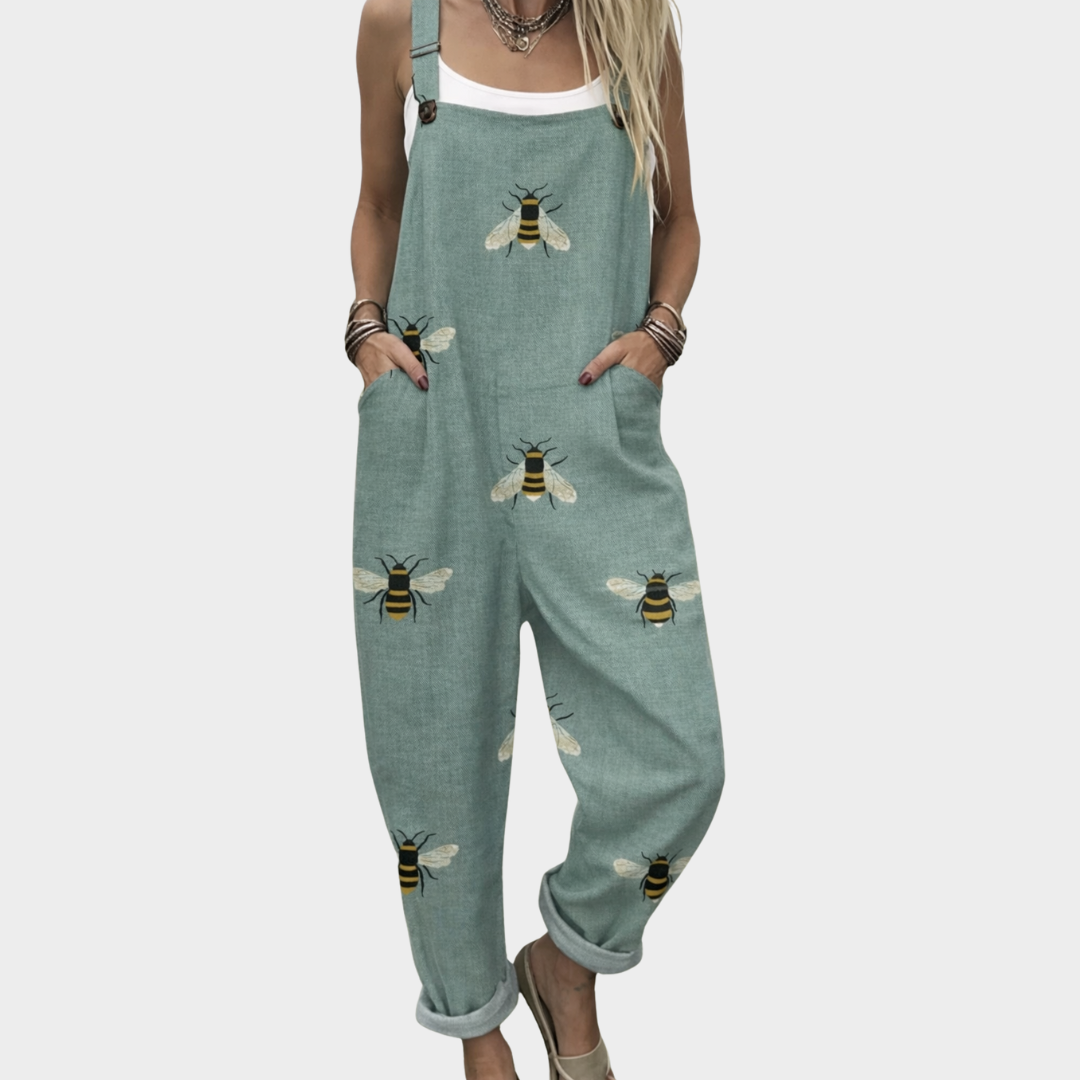 Loose green bee-print overalls with wide legs and adjustable straps