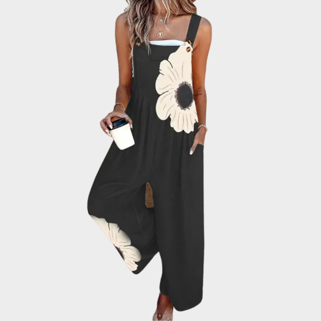 Loose printed overalls, sleeveless black with large white daisy floral front and wide legs