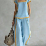 Light blue linen two-piece set with square neckline and matching wide-leg pants