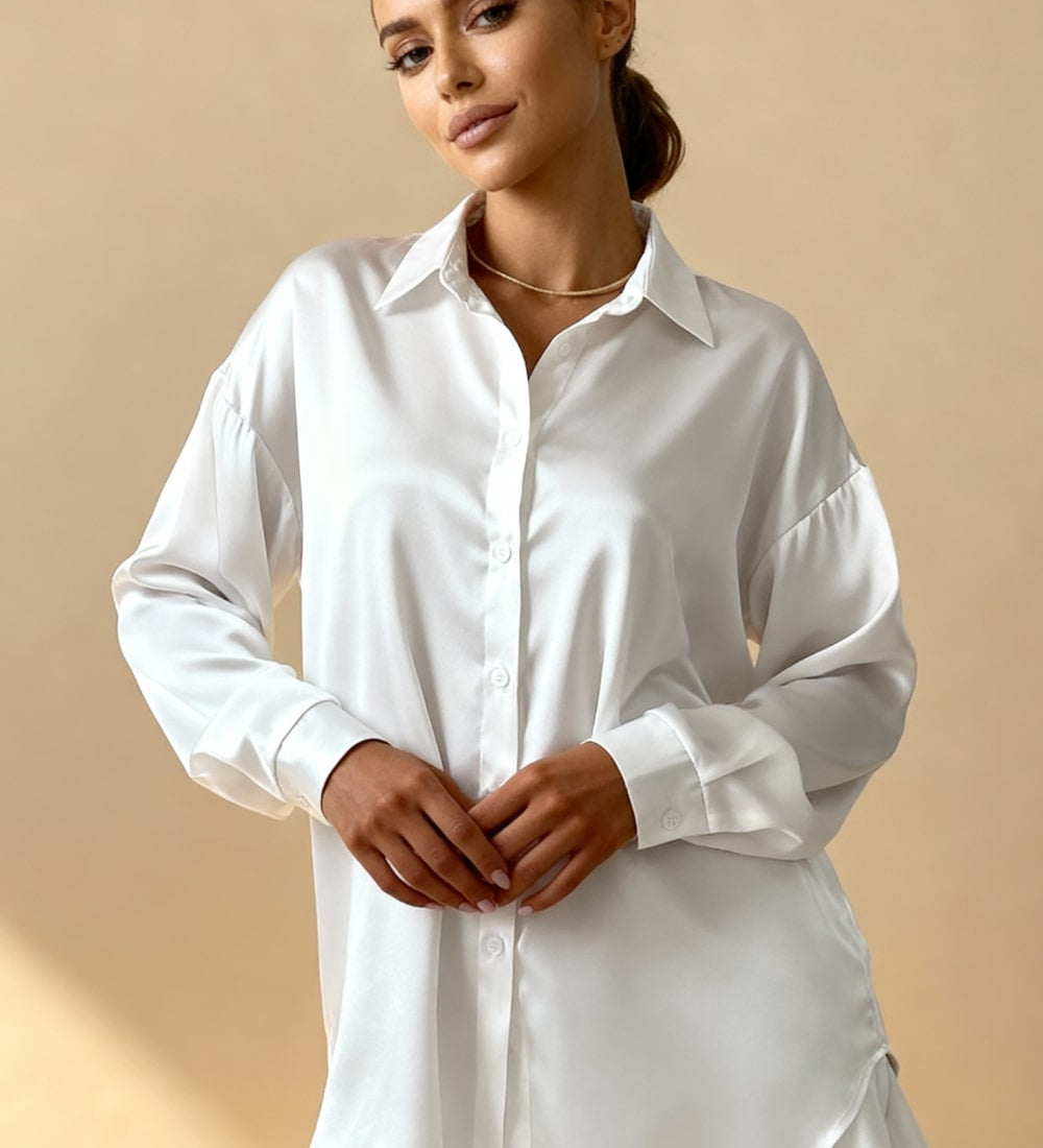 White button-front pajama blouse with point collar and long sleeves, high-low hem