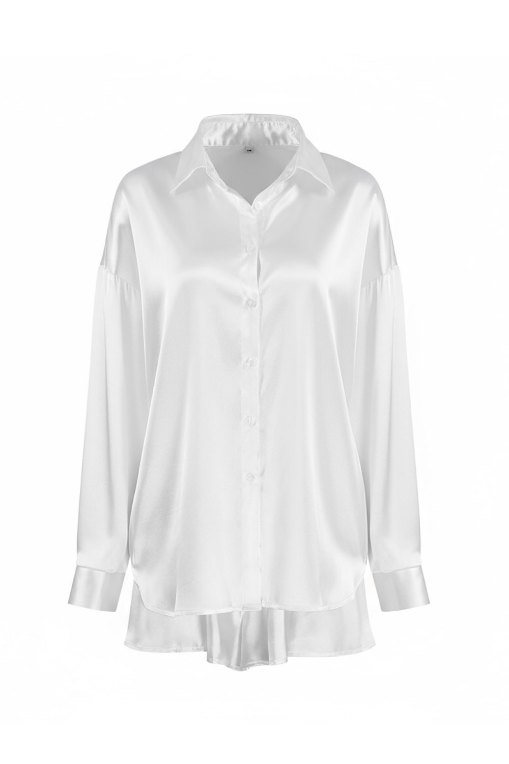 White button-front pajama blouse with pointed collar, long sleeves, relaxed ruffle hem