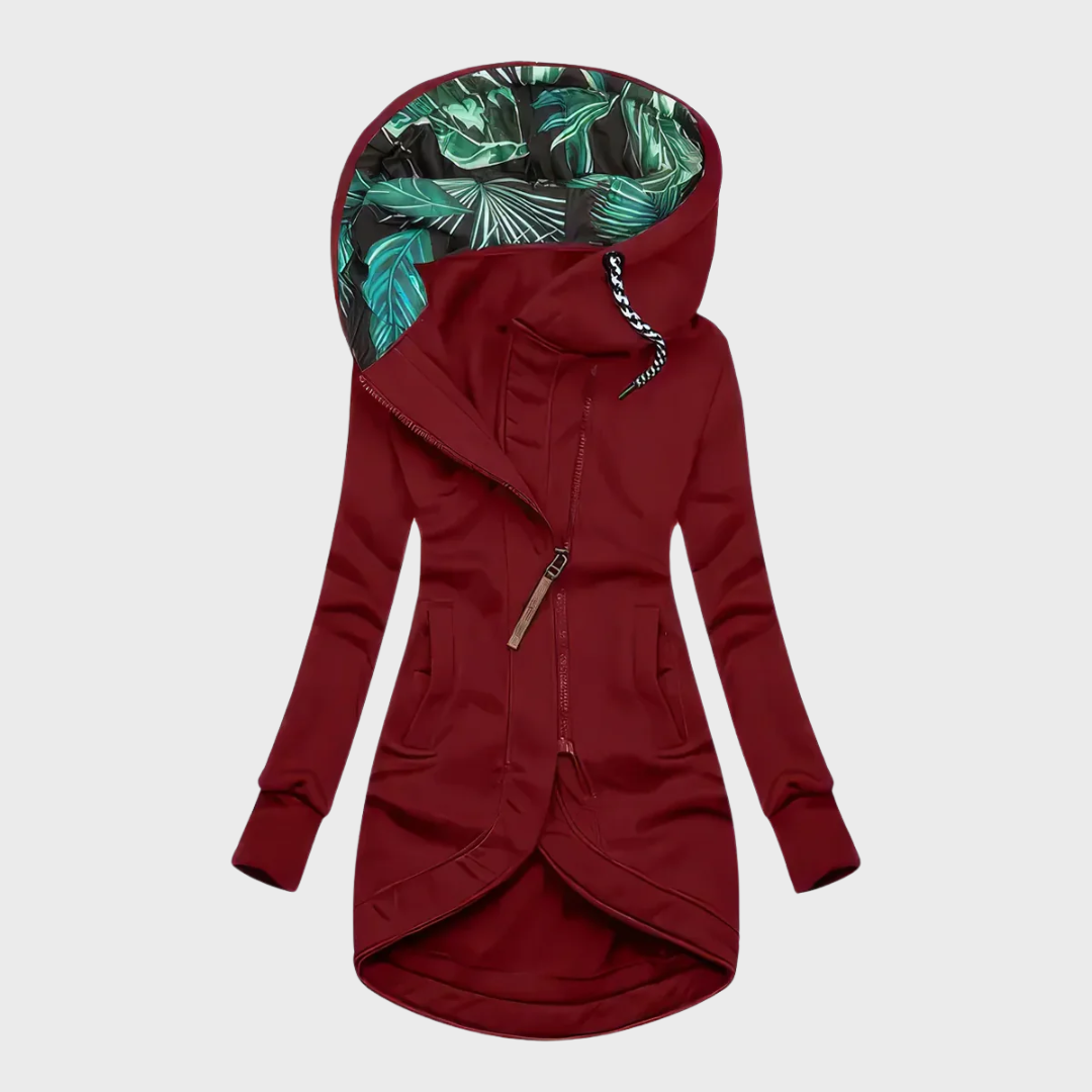 Red winter parka with hood, full zipper, side pockets, and teal-pattern hood lining
