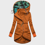 Rust orange winter parka with hood, full zipper, side pockets, and teal-pattern hood lining