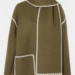 Olive green wool coat with integrated scarf, white contrast trim, front patch pocket and fringe