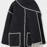 Black wool coat with integrated scarf, white contrast trim, front flap pockets and fringe
