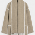 Women’s coat with integrated scarf, beige with white trim and fringe hem