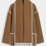 Women’s coat with integrated scarf, brown with white trim and fringe hem