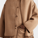 Camel brown wool coat with button placket and integrated scarf, frayed hem tassels