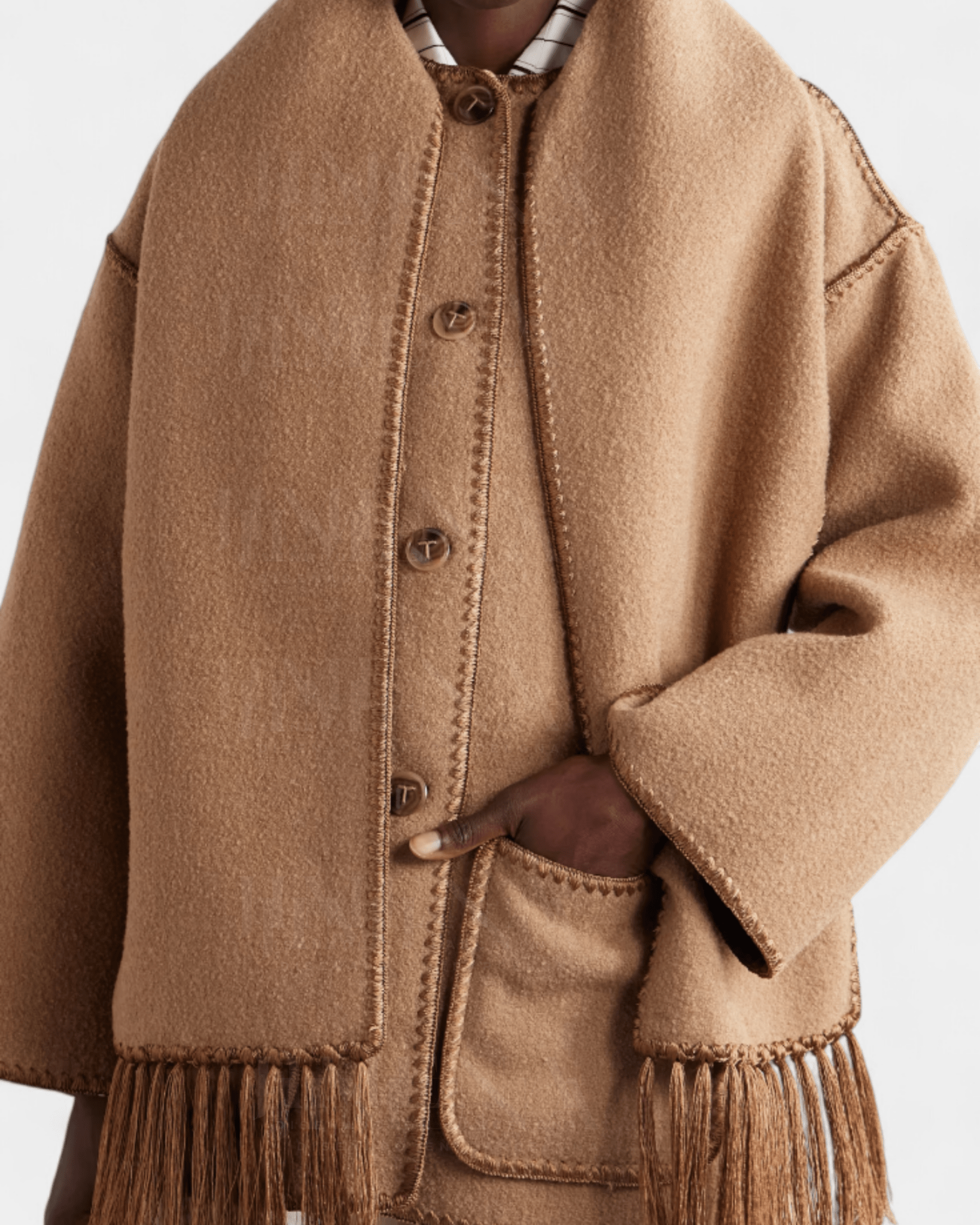 Camel brown wool coat with button placket and integrated scarf, frayed hem tassels