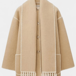 Beige wool coat with integrated scarf, front buttons, white contrast borders and fringed hem