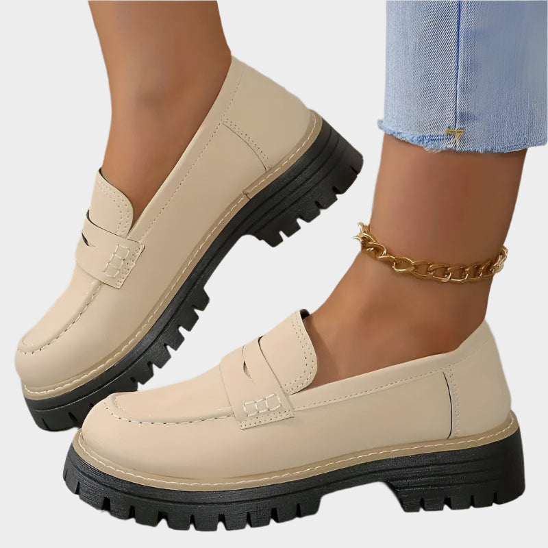 Light beige chunky-sole loafer moccasin with front strap and ridged rubber sole