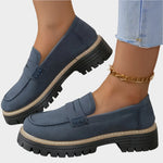 Navy blue chunky-sole loafer moccasin with front strap and rugged tread