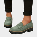 Sage green suede moccasin loafers with chunky lug sole and strap detail