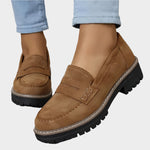 Tan suede moccasin loafers with chunky lug sole and strap detail