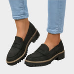 Black chunky-sole loafer moccasin with front strap and contrast edge stitching