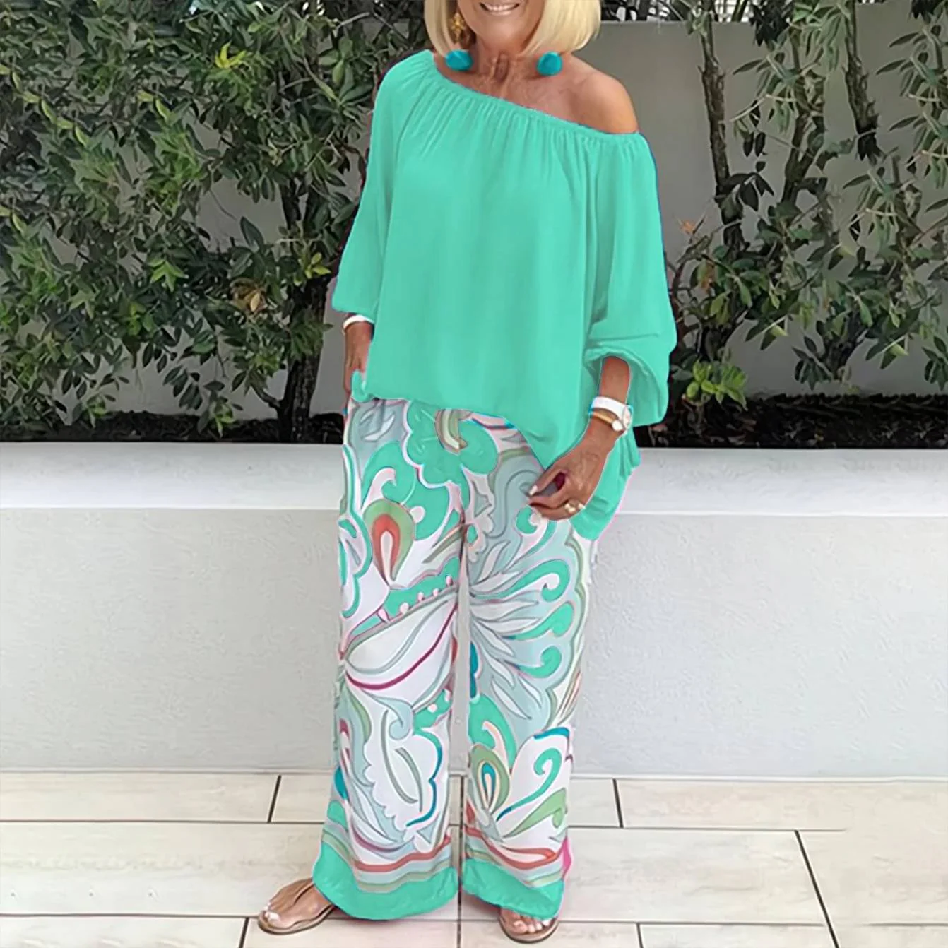 Teal off-shoulder peasant top and wide-leg printed pants two-piece set