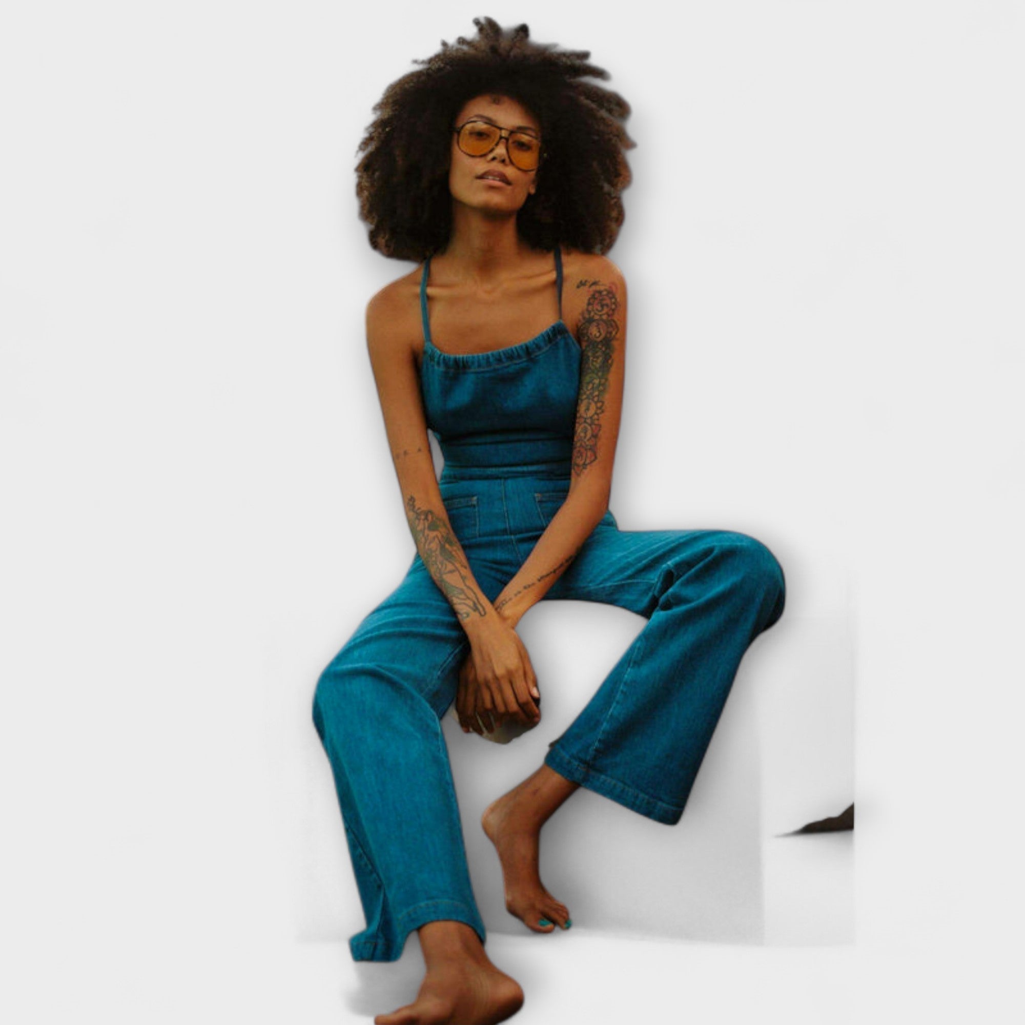 Blue denim wide-leg overalls with square neckline and gathered bodice