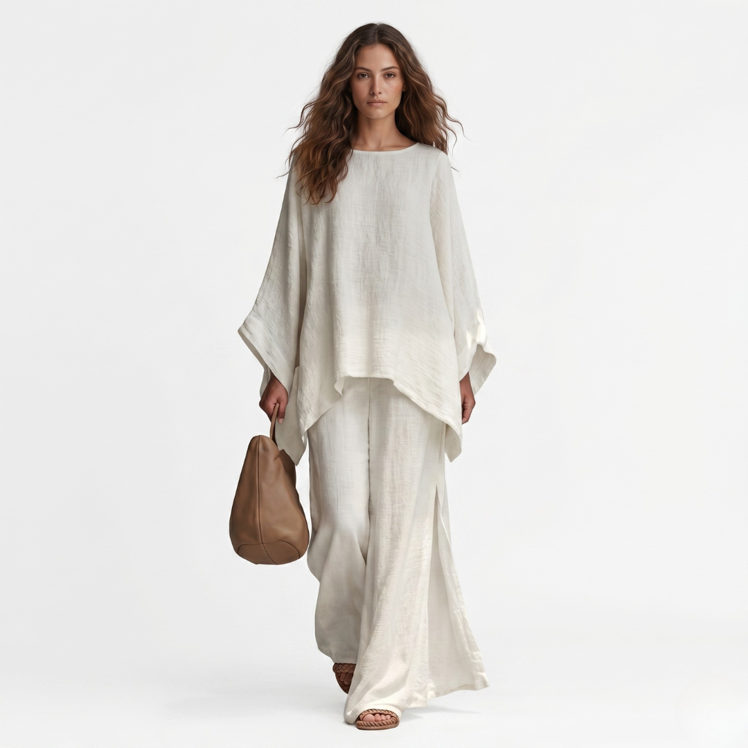 Two-piece set: off-white long-sleeve tunic top with wide-leg pants, draped hems