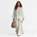 Two-piece set: off-white long-sleeve tunic top with wide-leg pants, draped hems