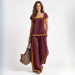 Burgundy linen two-piece set with square neckline and matching wide-leg pants