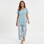 Light blue short-sleeve blouse with layered hem and matching leaf-pattern pants