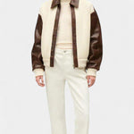Color-block knit jacket with brown sleeves, cream body, and zip front panel