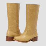 Light tan tall pull-on equestrian boots with block heel and side pull tab