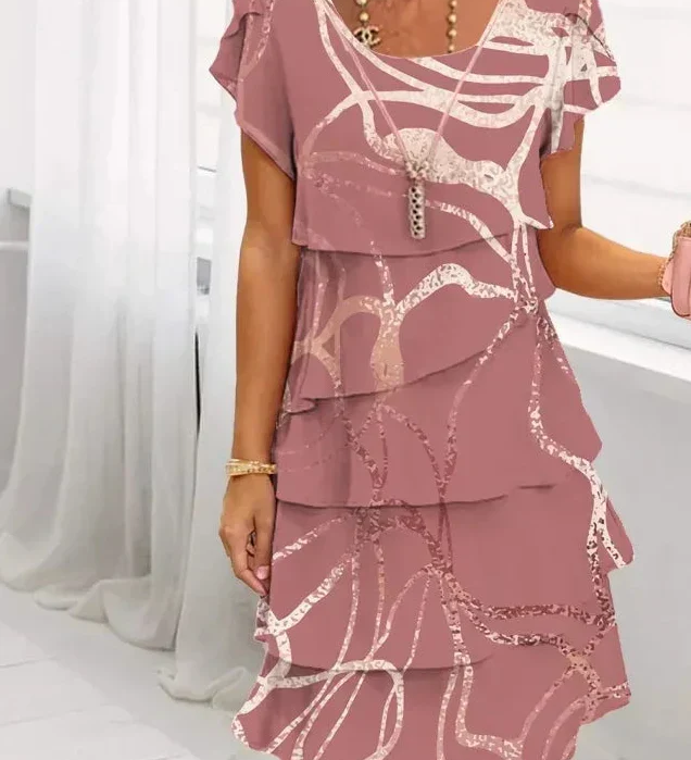 Pink patterned tiered dress with short cap sleeves and lace-trim neckline