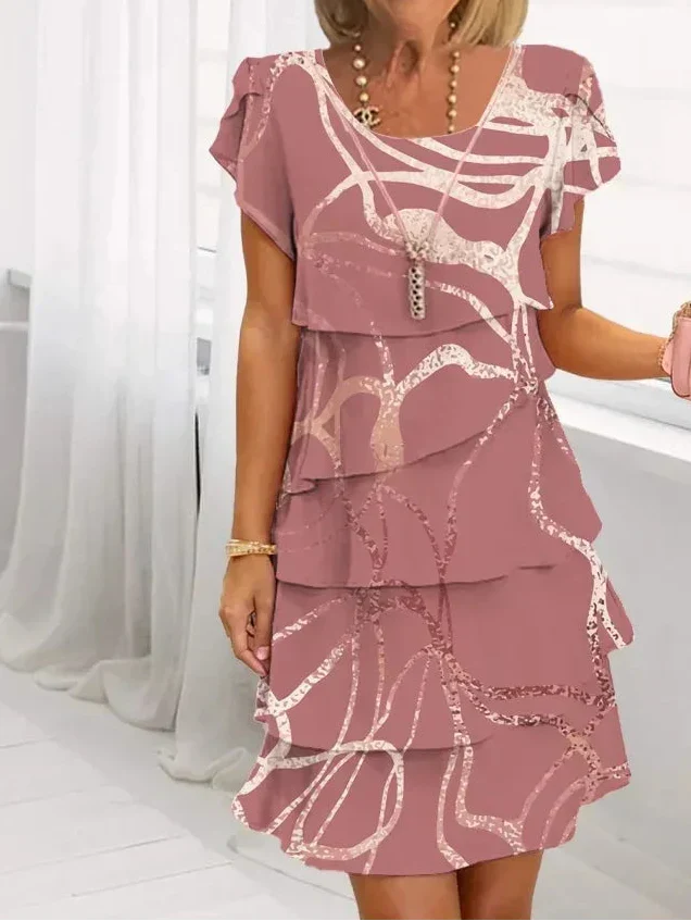 Pink patterned tiered dress with short cap sleeves and lace-trim neckline