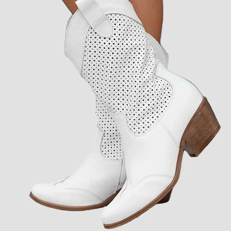 White cowboy ankle boots with perforated panels and mid-height block heel