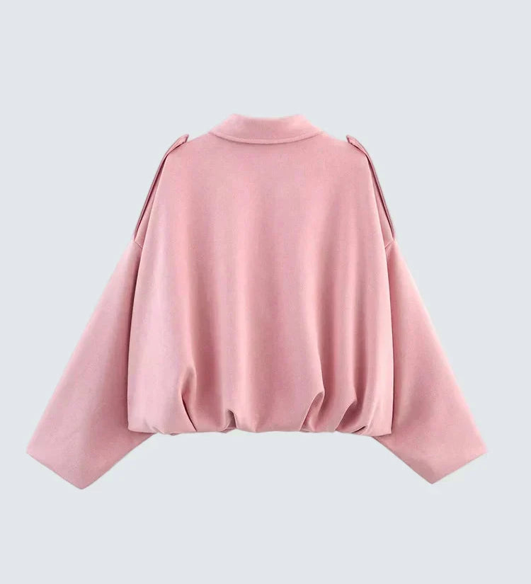 Pink short jacket with high round neckline, long sleeves and gathered back hem