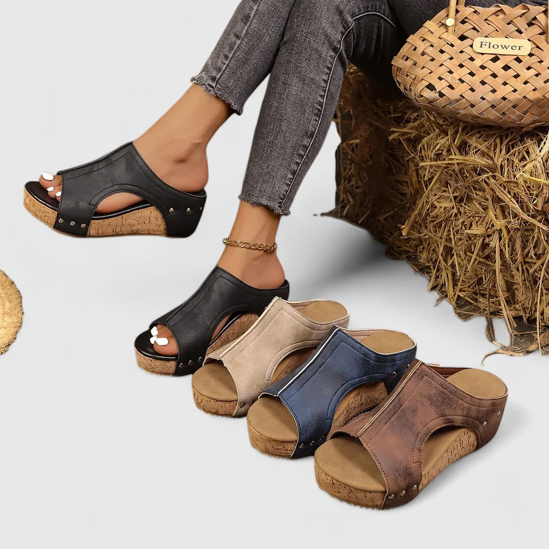 Set of platform orthopedic wedge sandals in black, navy, and brown with studded straps