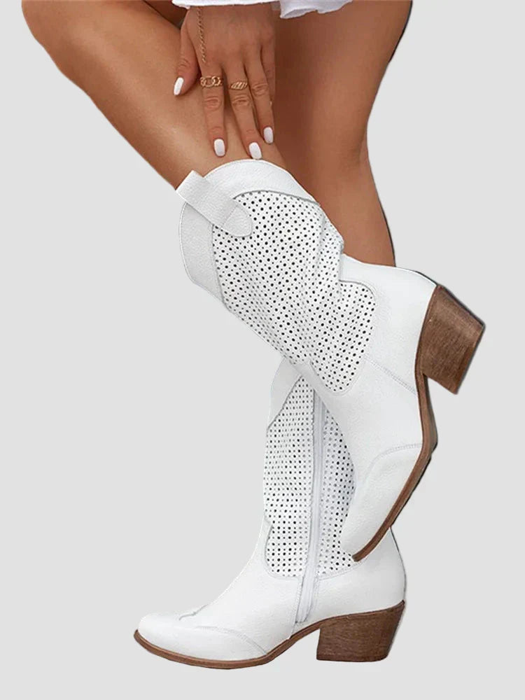 White cowboy boots with perforated sides and side zipper detail