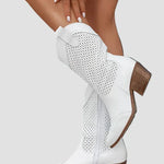 White cowboy boots with perforated sides and side zipper detail