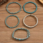 Turquoise bead bracelet set with silver-tone bangle and stacked beaded bands