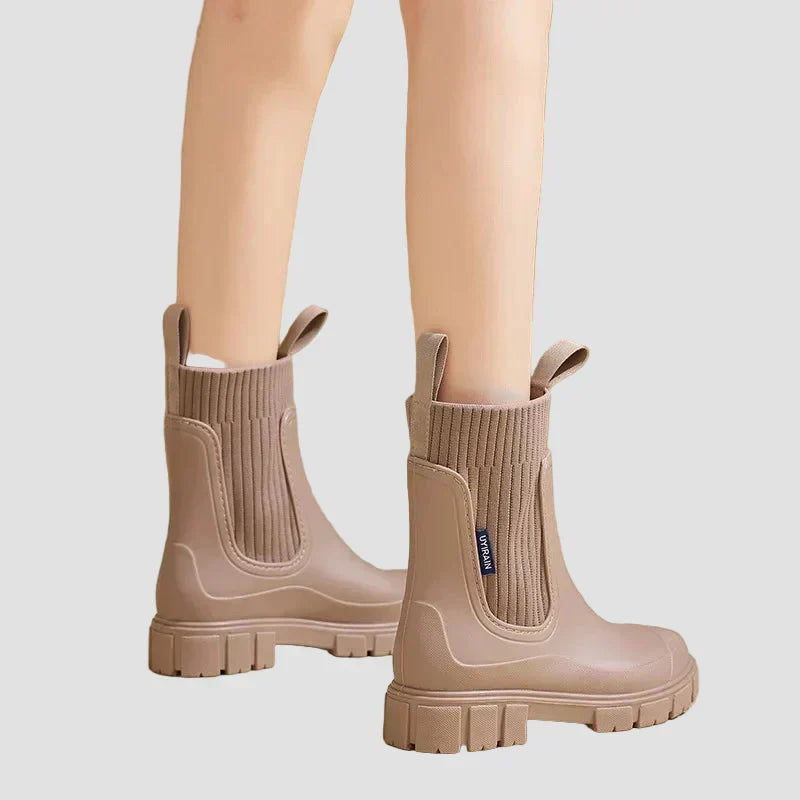 Waterproof brown Chelsea boots with ribbed elastic side panels and chunky tread sole