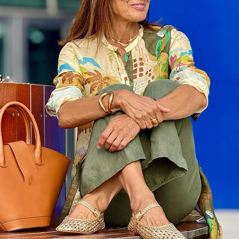 Women's linen and satin set close-up: printed blouse with olive pants