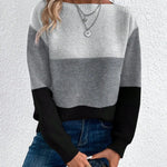 Color-block knit sweater, crew neck, long sleeves; light gray and black panels.