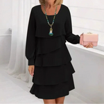 Black comfort dress with layered ruffle tiers and long sleeves