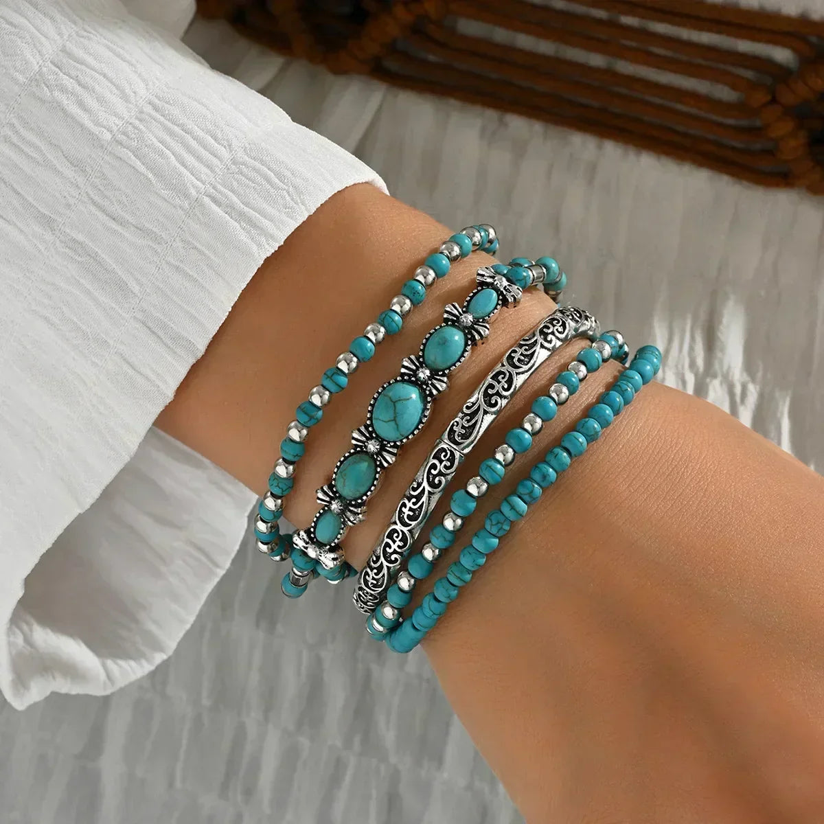 Turquoise beaded bracelet set with silver-tone filigree and oval gemstone accents