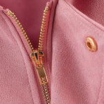 Pink short elegant jacket zipper and button detail with gold hardware