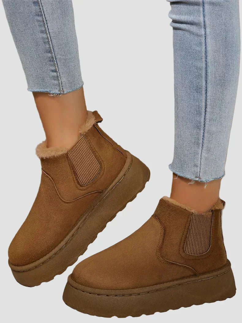 Tan brown winter ankle boots with elastic side panels and thick sole