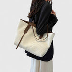 White woven tote bag with two top handles and zip closure
