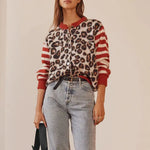 Leopard print button-front cardigan sweater with red striped sleeves