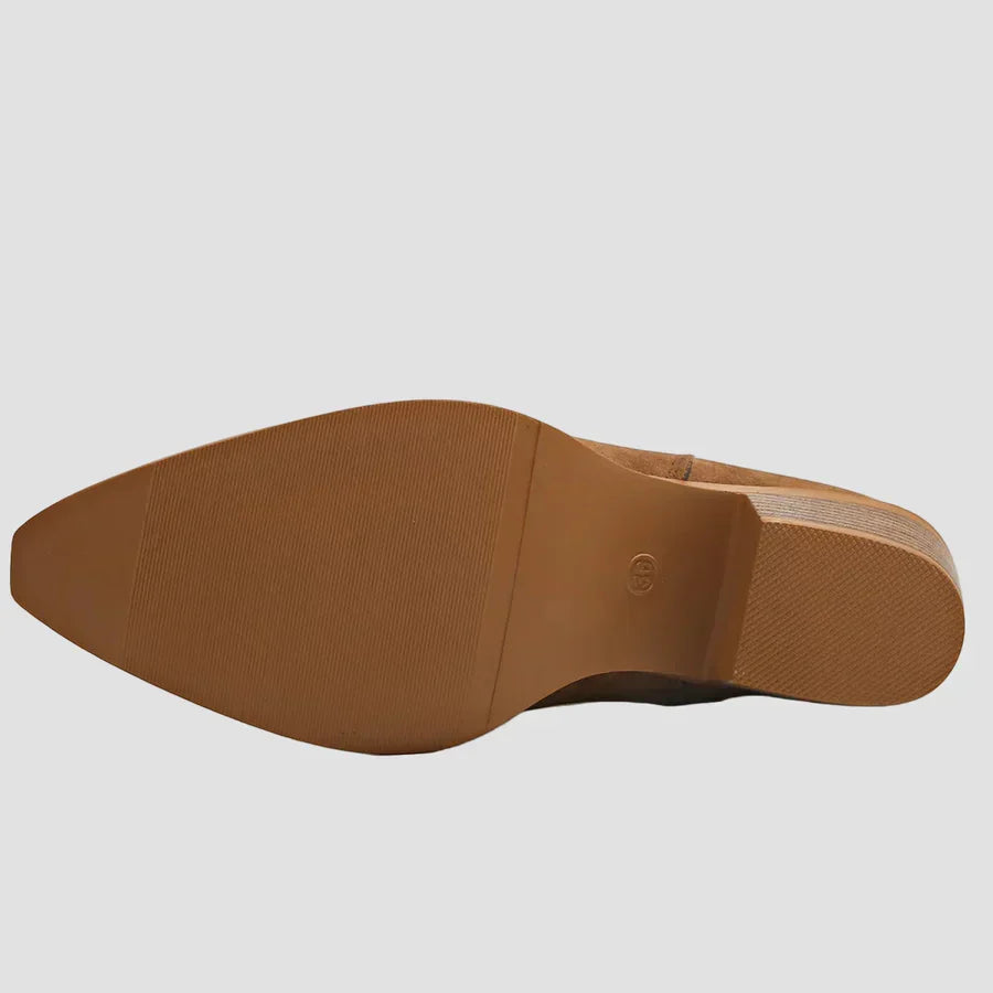 Brown boot outsole view with tread and side edge