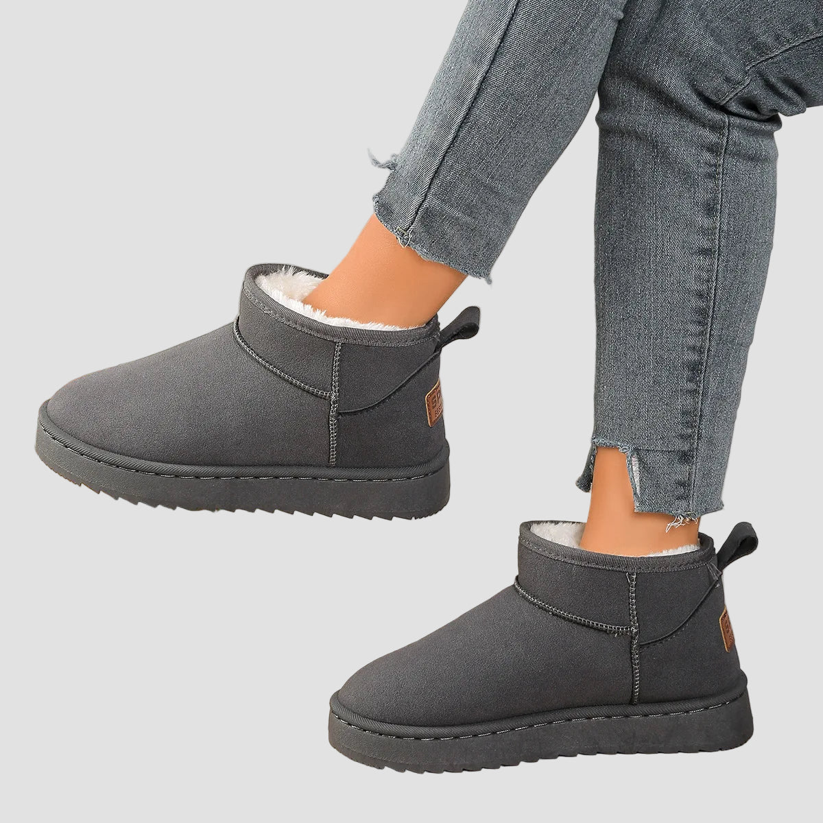 Pair of grey comfort ankle boots with round toe, pull tabs, thick sole, plush lining