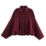 Burgundy short jacket with pointed collar, center zip, gathered hem and long sleeves