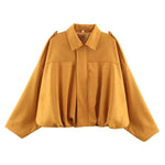 Mustard short jacket with pointed collar, center zip, gathered hem and long sleeves